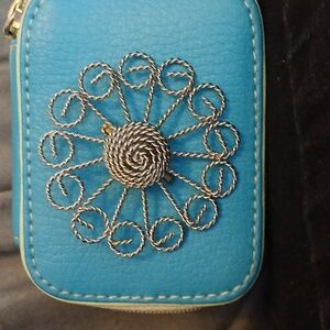 Twisted metal brooch flower